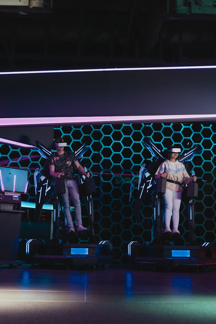 Two people engaged in a captivating virtual reality experience with VR headsets and consoles.