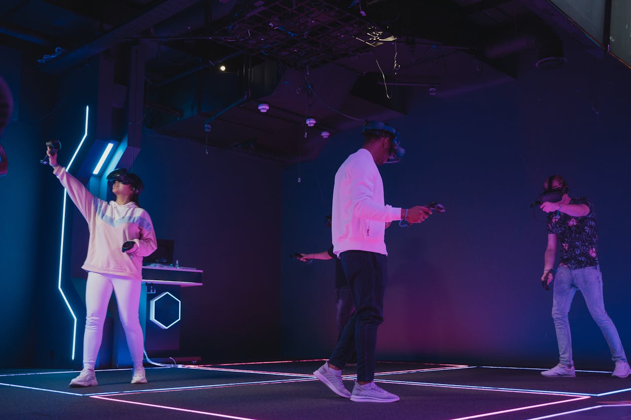 A group of adults enjoying a futuristic virtual reality gaming experience indoors.